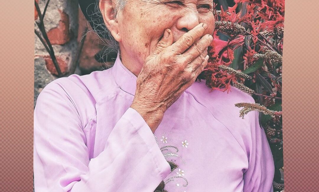 Elderly woman laughing-Empower Fusion portfolio