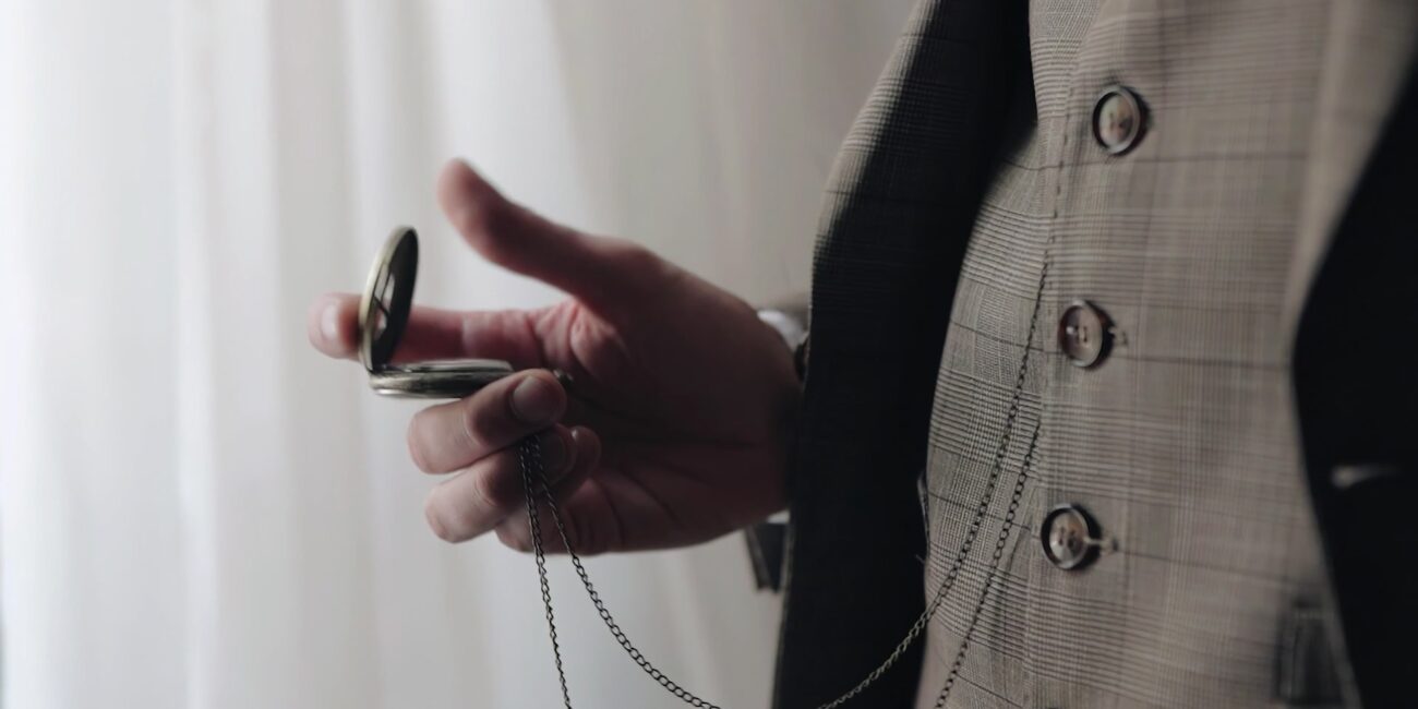 Gentleman in tailored suit looking at his stopwatch-Empower Fusion Portfolio